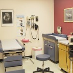 A contemporary medical examination room at a clinic.